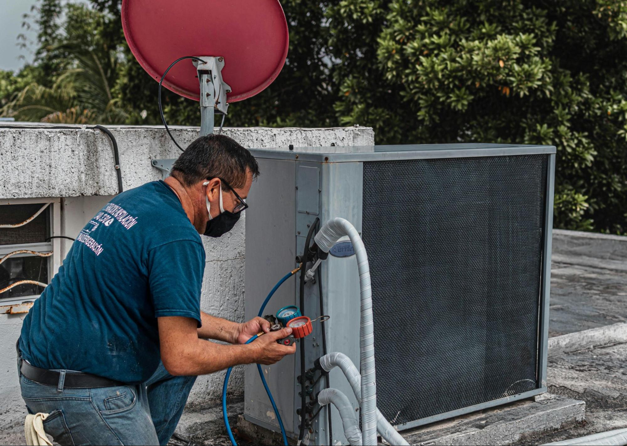 Technician doing an energy reading on HVAC system